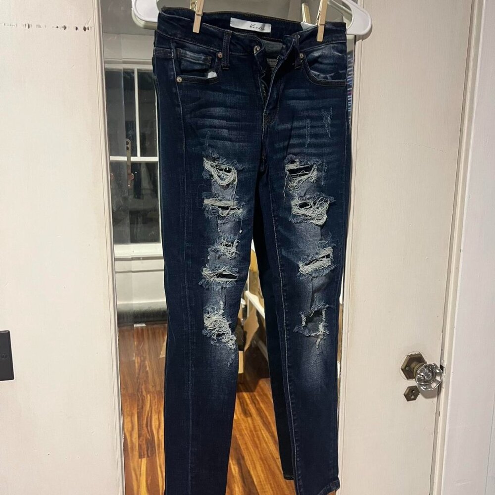 Dark wash distressed denim skinny jeans